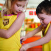 Child wearing Lenny tank top with pump pocket visible